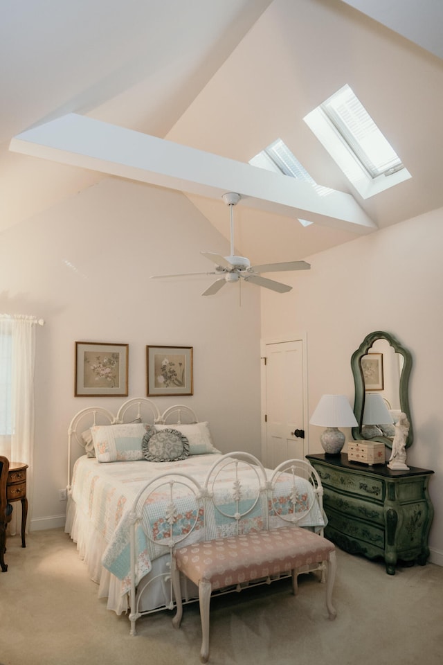 2860 Old Drake Dr, Johns Island, SC 29455 - bedroom featuring a skylight, light colored carpet, ceiling fan, beam ceiling, and high vaulted ceiling