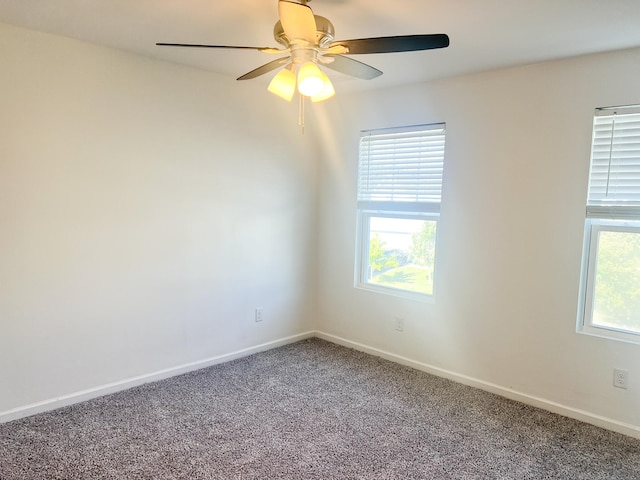 carpeted empty room with ceiling fan