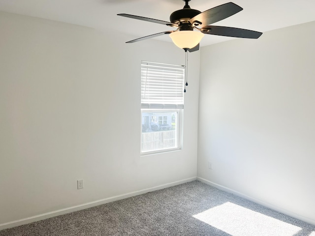 empty room featuring ceiling fan and carpet flooring