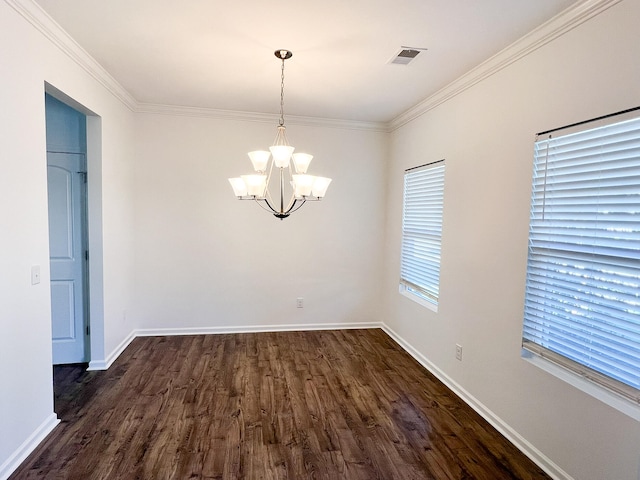 unfurnished dining area with crown molding, dark hardwood / wood-style flooring, and an inviting chandelier