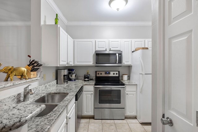 kitchen featuring a sink, white cabinetry, ornamental molding, and stainless steel appliances