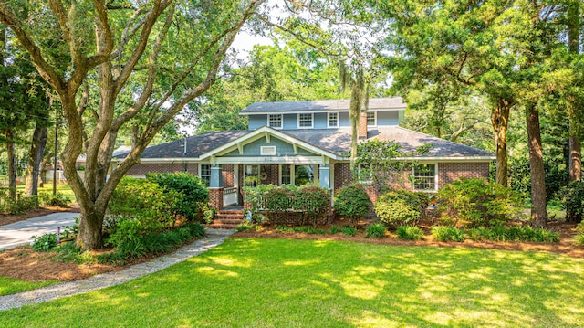 802 Robert E Lee Blvd, Charleston, SC 29412 - view of front of property featuring a front lawn, brick siding, and roof with shingles