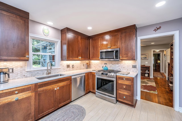 802 Robert E Lee Blvd, Charleston, SC 29412 - kitchen featuring stainless steel appliances, light countertops, backsplash, light wood-style floors, and recessed lighting