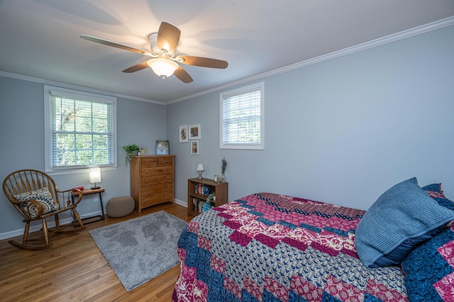 802 Robert E Lee Blvd, Charleston, SC 29412 - bedroom with wood finished floors, multiple windows, ornamental molding, and a ceiling fan