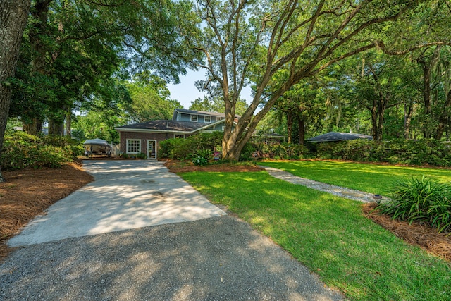 802 Robert E Lee Blvd, Charleston, SC 29412 - view of front of house with concrete driveway and a front lawn