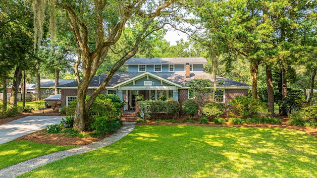 802 Robert E Lee Blvd, Charleston, SC 29412 - traditional home featuring a front lawn, concrete driveway, and brick siding
