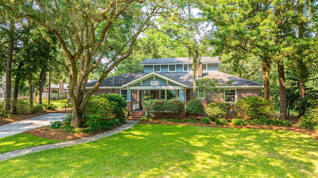 802 Robert E Lee Blvd, Charleston, SC 29412 - view of front of home with a front yard, brick siding, and a shingled roof