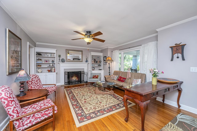 802 Robert E Lee Blvd, Charleston, SC 29412 - living room with wood-type flooring, a ceiling fan, a brick fireplace, and ornamental molding
