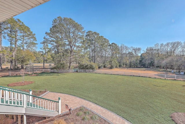 view of yard with a rural view