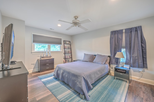 bedroom featuring ceiling fan and dark hardwood / wood-style floors