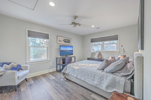 bedroom featuring hardwood / wood-style floors and ceiling fan