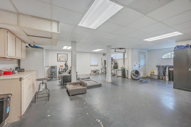 basement featuring a paneled ceiling