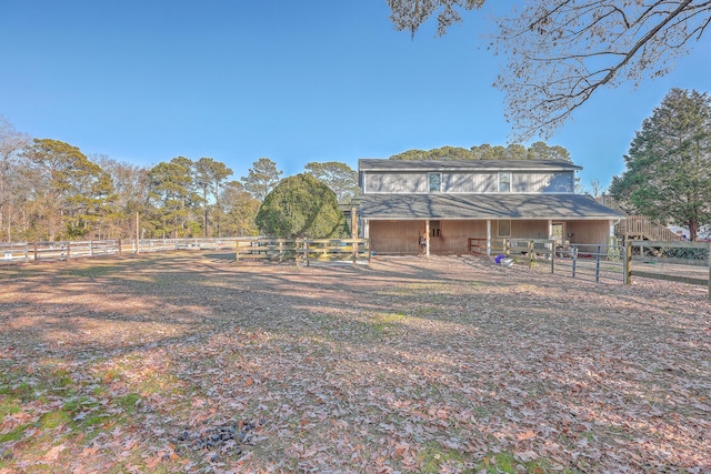 exterior space with an outbuilding and a rural view