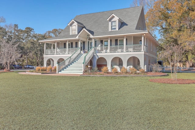 view of front of property featuring a front yard and covered porch