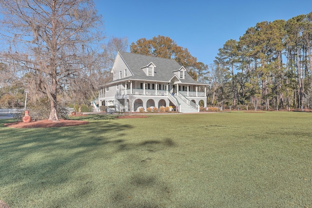 view of front of property featuring a porch and a front yard