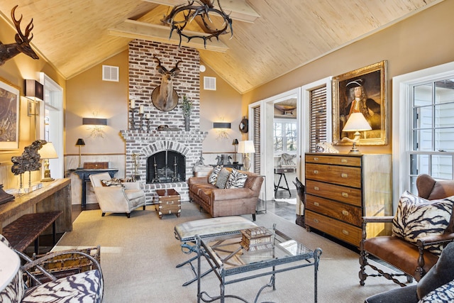 carpeted living room with a fireplace, high vaulted ceiling, visible vents, and wood ceiling