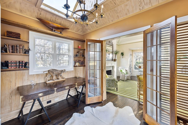 home office with wood-type flooring, an inviting chandelier, wooden ceiling, and a fireplace