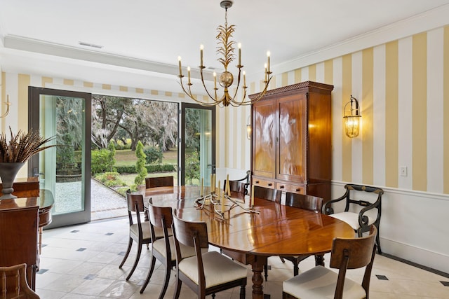 dining room featuring wallpapered walls, visible vents, crown molding, and a healthy amount of sunlight