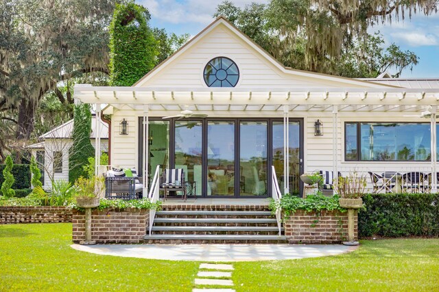 rear view of house with a lawn