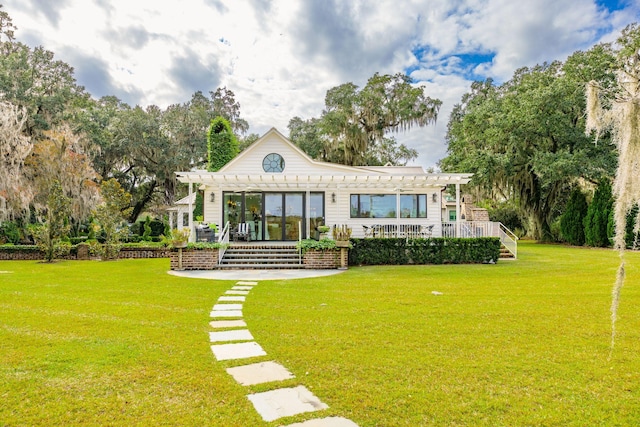 back of house with a pergola and a yard