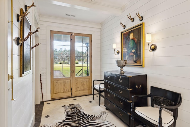 entryway with ornamental molding, french doors, beamed ceiling, and visible vents