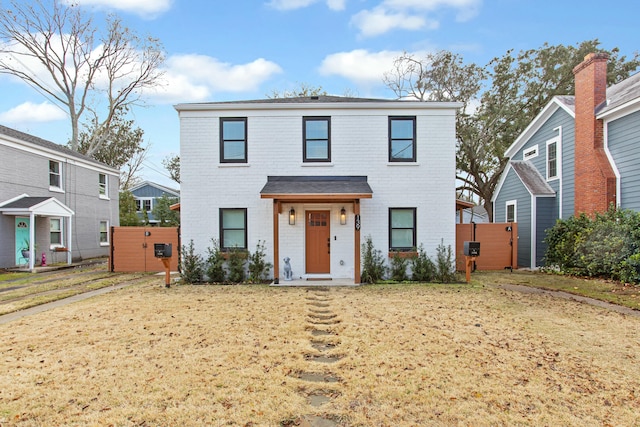 front facade featuring a front lawn