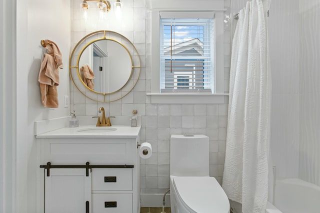 full bathroom featuring shower / bath combination with curtain, vanity, toilet, and tile walls