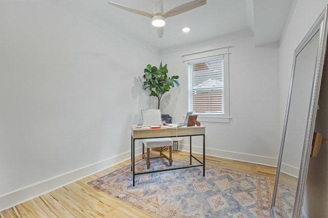 office featuring hardwood / wood-style flooring, ceiling fan, and crown molding