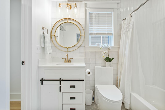 full bathroom featuring vanity, shower / bathtub combination with curtain, toilet, and tile walls