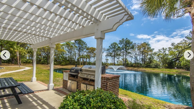 view of patio with a water view, area for grilling, a pergola, and a grill