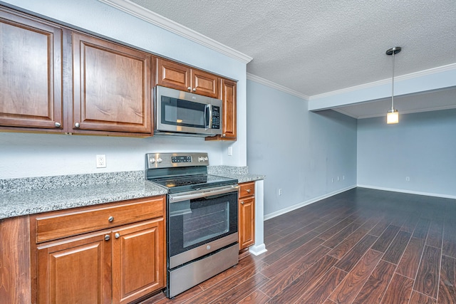 kitchen with light stone counters, crown molding, stainless steel appliances, decorative light fixtures, and dark hardwood / wood-style floors