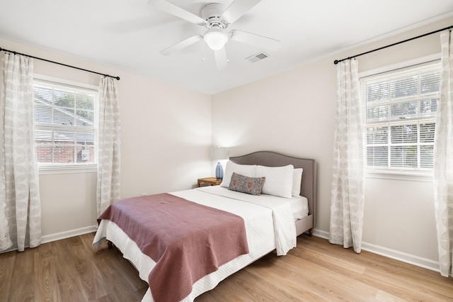 305 Forest Cir, Summerville, SC 29483 - bedroom with light wood-style flooring, baseboards, and a ceiling fan