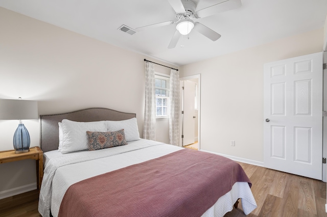 305 Forest Cir, Summerville, SC 29483 - bedroom with light wood-type flooring, baseboards, and a ceiling fan