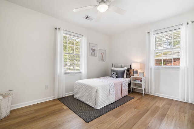 305 Forest Cir, Summerville, SC 29483 - bedroom featuring light wood-style flooring, baseboards, and a ceiling fan
