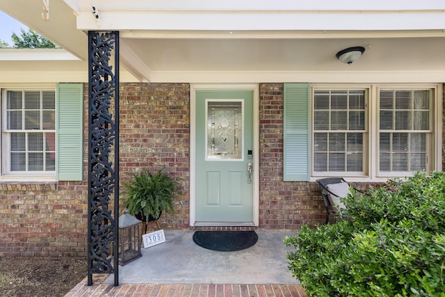 305 Forest Cir, Summerville, SC 29483 - view of exterior entry with a porch and brick siding