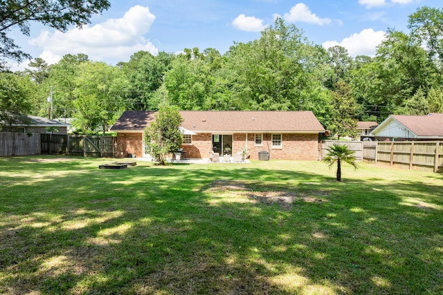 305 Forest Cir, Summerville, SC 29483 - back of house with brick siding, a patio, and roof with shingles