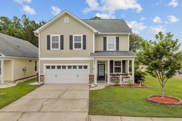 520 Crossland Dr, Moncks Corner, SC 29461 - traditional-style house featuring a porch, concrete driveway, a garage, a front yard, and stone siding