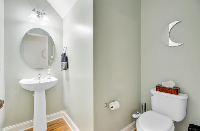 520 Crossland Dr, Moncks Corner, SC 29461 - half bath featuring toilet, baseboards, and wood finished floors