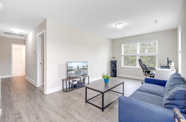 520 Crossland Dr, Moncks Corner, SC 29461 - living room featuring light wood-type flooring, baseboards, and an office area