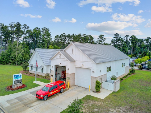 520 Crossland Dr, Moncks Corner, SC 29461 - view of front facade featuring concrete driveway, board and batten siding, metal roof, a standing seam roof, and an attached garage