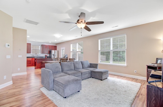 520 Crossland Dr, Moncks Corner, SC 29461 - living area featuring light wood-type flooring, baseboards, and a ceiling fan