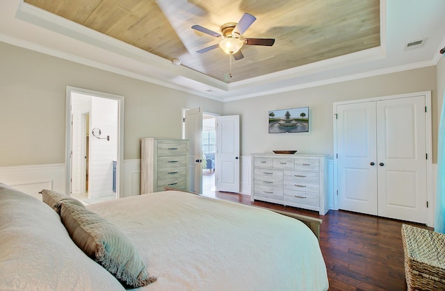 bedroom featuring visible vents, ornamental molding, dark wood-type flooring, a raised ceiling, and wood ceiling