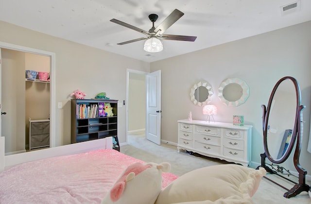 bedroom with ceiling fan, light carpet, baseboards, visible vents, and a closet