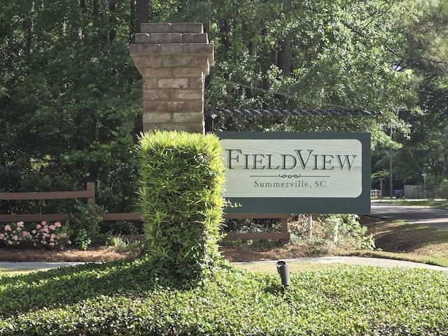 community sign with fence