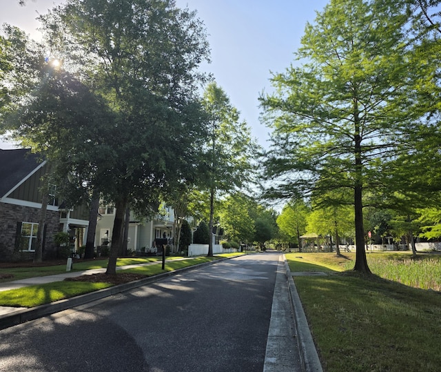 view of road featuring sidewalks and curbs