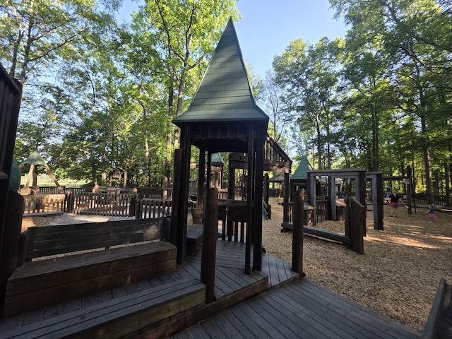 wooden terrace featuring playground community