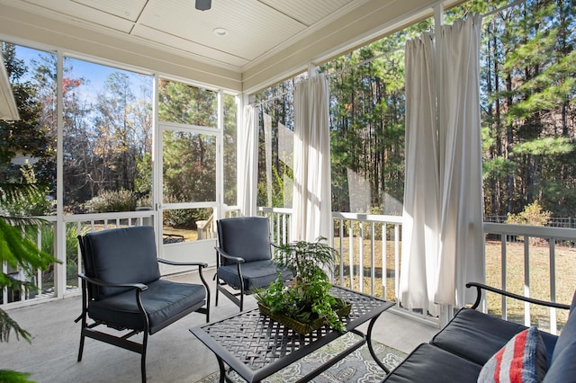 sunroom / solarium featuring wooden ceiling