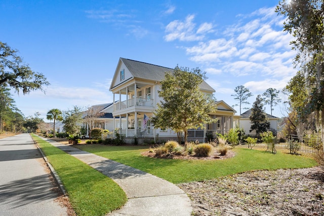 view of property exterior featuring a yard and a balcony