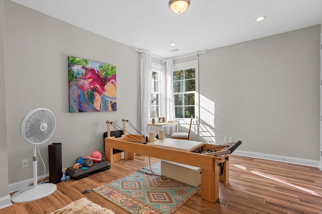 home office with wood-type flooring