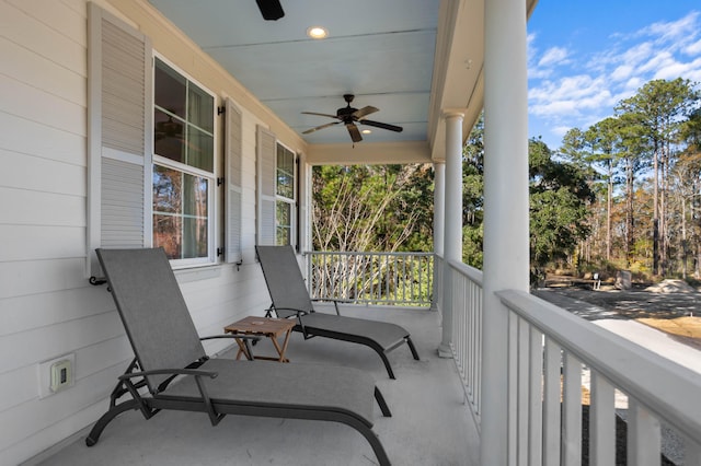 balcony with ceiling fan and covered porch